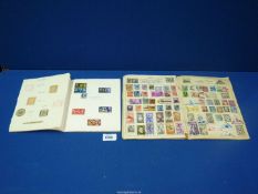 Two small stamp albums and contents of International stamps up to 1967 including 1966 World Cup