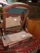 An Edwardian table top Mirror with lower drawers, on bun feet.