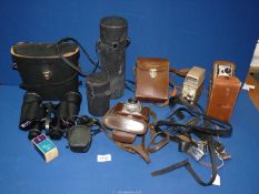 A quantity of cameras and binoculars, etc.