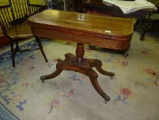 A Rosewood and other woods cross-banded topped flap-over Card Table standing on a turned pillar