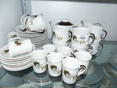 A Royal Doulton 'Westwood' tea service for eight including teapot, sugar bowl and milk jug,