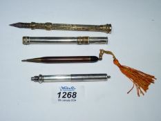 Four propelling pencils including 925 silver, yellow metal marked G. Cornfield, etc.