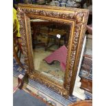 A heavily moulded framed Wall hanging Mirror, 43 1/4'' x 31 1/2'' approx.