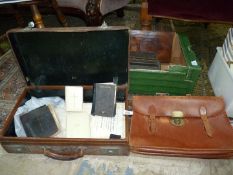 A vintage leather suitcase marked 'Rev. C.D.
