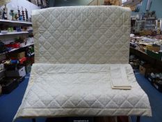 A Dorma king-size quilted bedspread in cream and white with lace style pattern plus a matching