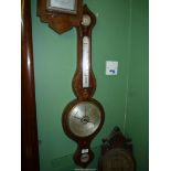 A Banjo Barometer with gilt scroll detail.