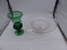 A hand blown green glass urn with pontil mark, one handle a/f,