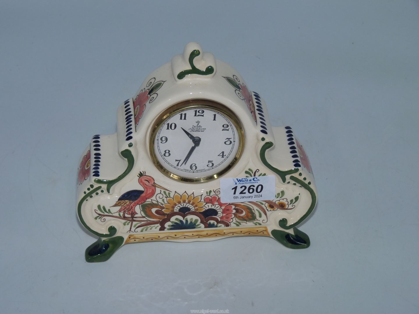 An unusual Poly Delfts hand-painted Holland porcelain cased mantel Clock, decorated with flowers,