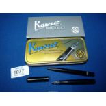 A Kaweco Lilliput fountain pen set and ballpoint pen in a tin case.