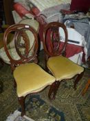 A pair of heavy Mahogany framed serpentine front side Chairs standing on swept front legs and