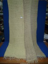 A Welsh wool waffle weave blanket in yellow with brown flecks.
