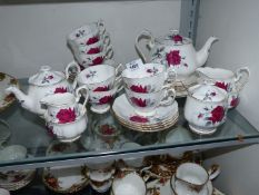 A Royal Albert 'Sweet Romance' tea service for six plus extra cups, saucers and tea plates,