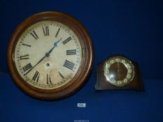 A circular Ansonia Clock Co. wall clock and a Bentima mantle clock.