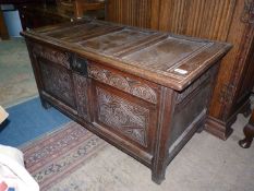 A two panel peg-joined Oak Blanket Chest/Coffer having carved details,