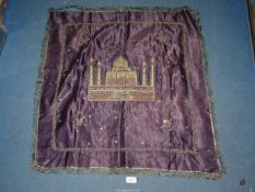 An embroidered and beaded Indian wall hanging of The Taj Mahal Agra, India 1945 on purple fabric,