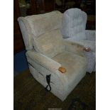 A pale green upholstered electric reclining/raising Armchair, working,