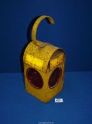 A 'Chalwyn' railway lamp, painted yellow.