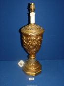 A gilt lamp base with moulded cherub decoration in classical style, 20 1/2'' high.