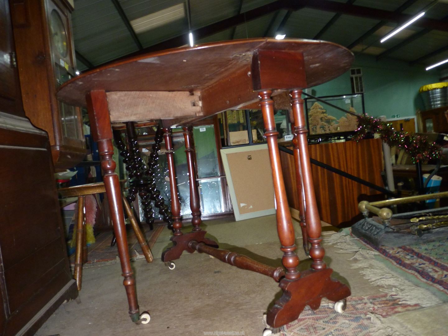 A circa 1900 Satinwood Sutherland type Table standing on turned supports and stretchers and being - Image 3 of 4