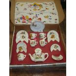 A boxed children's doll's Teaset with nursery rhyme details and Mabel Lucie Attwell handkerchief.