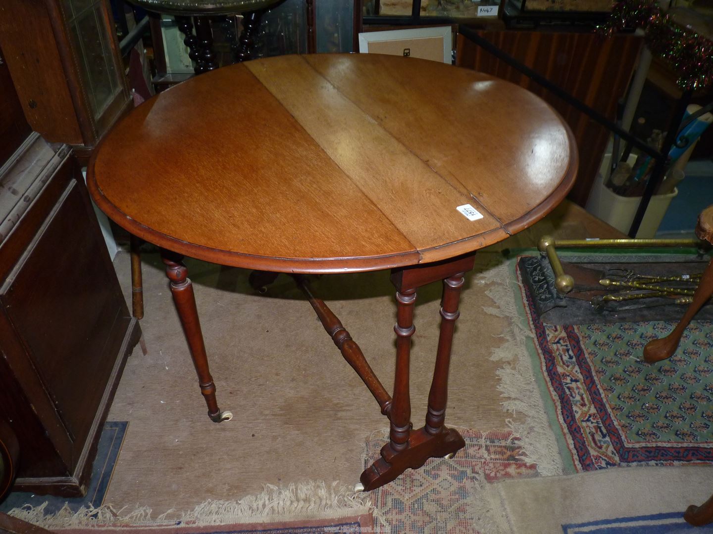 A circa 1900 Satinwood Sutherland type Table standing on turned supports and stretchers and being - Image 2 of 4