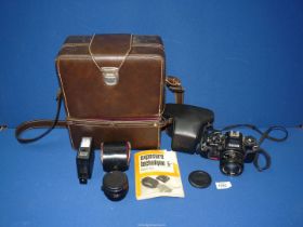 A Ricoh KR-10 camera with flash unit and extra lens in carry bag, with instructions.