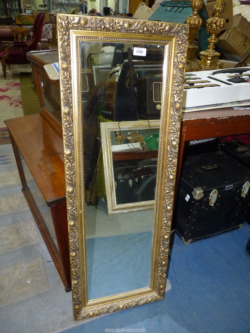 A rectangular gilt type finished framed mirror, 15 1/4" x 42".