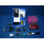 An Adidas watch, Blackberry 8900 phone components and Nikon Coolpix camera S9500.