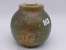 A Carltonware vase in sphere shape with scenes of pagodas and trees in gold highlighted detail on a