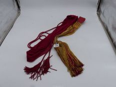 An Officer's scarlet Military sash and a ceremonial Officer's sash/waist belt,