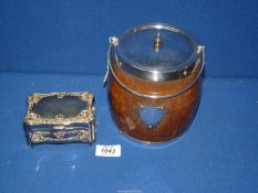 An Oak biscuit barrel having plated mounts and ceramic liner,