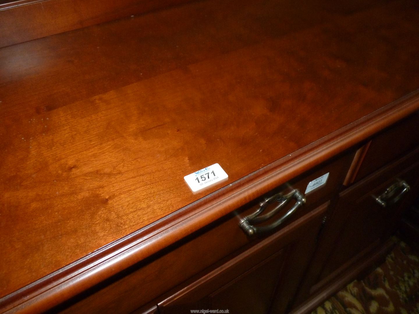 A contemporary darkwood possibly Cherrywood Sideboard having three frieze drawers over a cupboard - Image 2 of 2