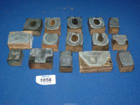 A quantity of early 20th century small printing blocks apparently for trade adverts for an