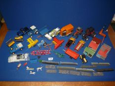 A quantity of model tractors and farm implements including Massey Ferguson, Landrover,