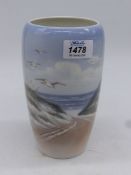 A Royal Copenhagen vase with a seashore scene with dunes and seagulls, 7 1/2" tall.