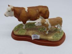 A Border Fine Arts figure group of 'Simmental Cow and Calf', 6'' x 8'' overall.