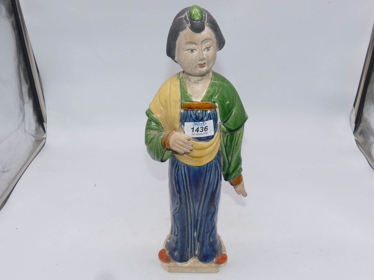 A Chinese pottery figure after a model of a Court lady from the Tang dynasty, 16 1/2" tall.