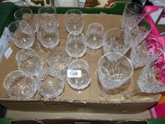 A quantity of cut glass including five cut glass wine glasses,
