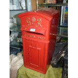 A reproduction of a George VI type Classic Red Post Box having cast metal front and in post box red