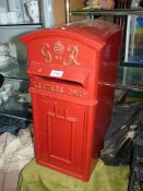 A reproduction of a George VI type Classic Red Post Box having cast metal front and in post box red