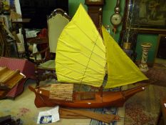 A large hand made Model of a fishing boat carved in 1996 in the traditional style and made from one