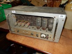 A heavy unbranded vintage Valve Amplifier having milliamperes gauge and chromium plated handles.