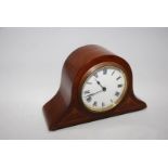 An attractive Mahogany/Walnut cased Mantel Clock of compact dimensions with inlaid decoration,