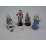 Four small china figures including a pair of musicians, an angel and a little girl reading.