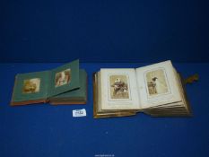 Two photograph Albums and contents dating from 1910, (clasp missing on one album).
