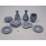 Eight pieces of pale blue Wedgwood Jasperware to include three vases, two boxed and pin trays.