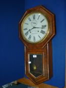 A Rosewood/Walnut finished Wm Oswin of Hereford octagonal surround eight-day Wall Clock having a