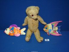 An old jointed Merrythought teddy bear from the 1950's and two "Beanie" baby fishes.