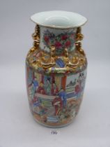 A large Chinese Cantonese vase having hand painted figures and warriors on horseback with gilt dogs