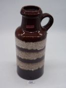 A West German Scheurich pottery vase in brown with white bands, 14'' tall.